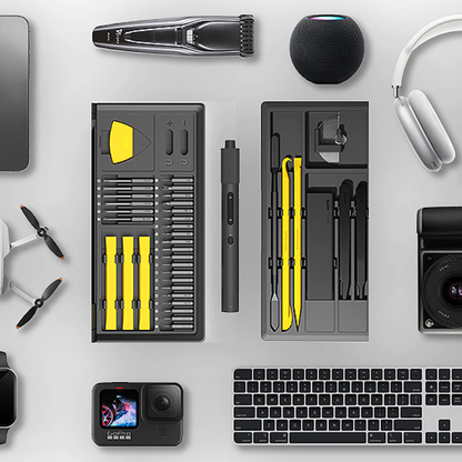 Collection of tools and electronic devices on a light gray surface