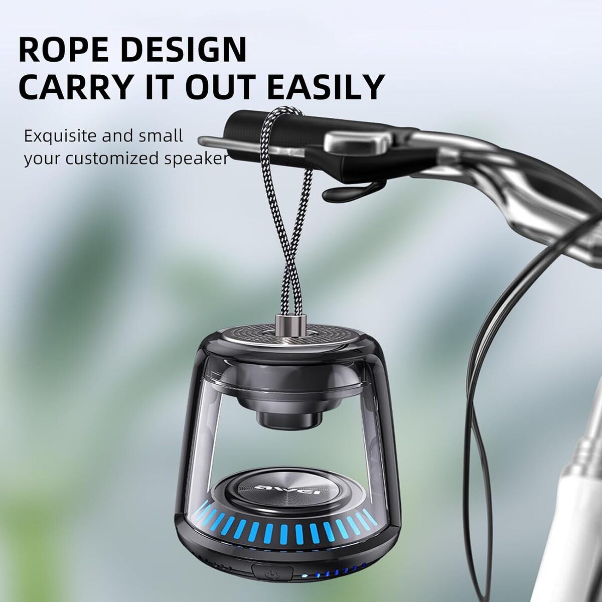 Smart speaker with rope design hanging from a handlebar against a blurred green background