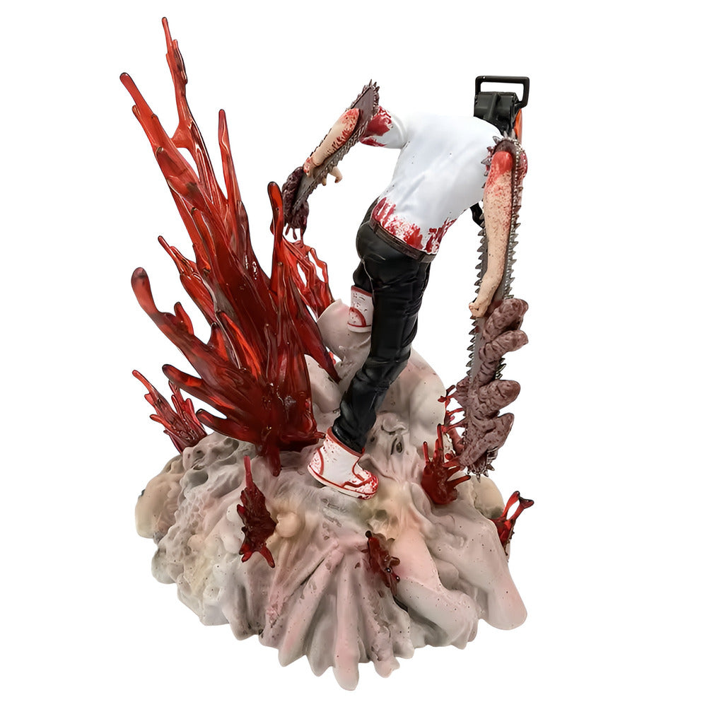 Gory figurine with red coral-like structure and a person in white shirt and black pants on a white background
