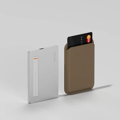 Sharge Disk Plus Ultra‑Slim SSD Enclosure (0.24", 10Gbps, 4TB, 100W PD)
Silver wallet and brown cardholder with a card on a light gray background