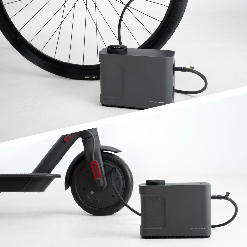 Black battery pack with bicycle and scooter wheels on a white background