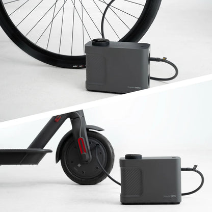 Black battery pack with bicycle and scooter wheels on a white background