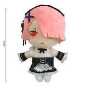 Plush toy with pink hair and a cross on the head, standing next to a ruler for scale.