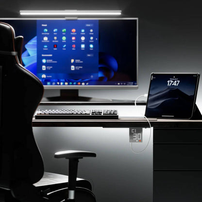 Sharge Pixel 100W GaN Charger (3×USB‑C, USB‑A, Dot‑Matrix Display) Modern office setup with a computer monitor, keyboard, and tablet on a desk.