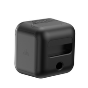Black cube-shaped device with a brand logo on a white background
