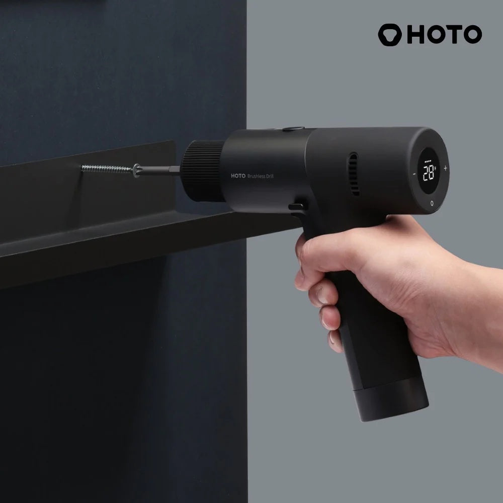Black handheld tool with digital display held by a hand against a dark background, featuring the HOTO brand.