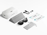 Rokid AI Glasses Style (ChatGPT & Gemini, 12MP POV Camera, Real‑Time Translation) Packaged sunglasses with accessories on a white background