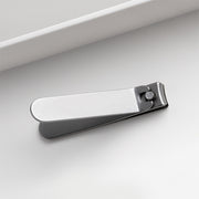 HOTO Clicclic Three-Piece Nail Clipper Set Metallic nail clipper on a light grey background