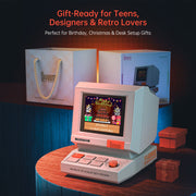 Divoom MiniToo Retro Pixel Bluetooth Speaker (1.77" Screen, 5W, App Control) Vintage-style handheld gaming console with 'Divoom' branding, surrounded by gift boxes and packaging.