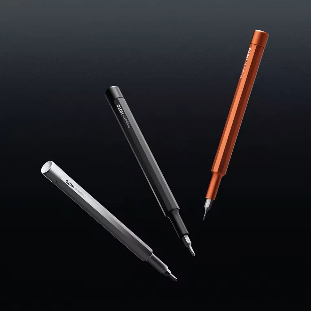 HOTO Pocket Precision Screwdriver SE Three pens in different colors on a black background