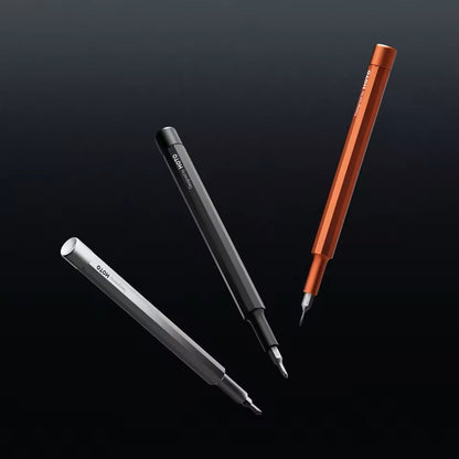 HOTO Pocket Precision Screwdriver SE Three pens in different colors on a black background