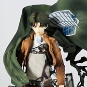 Figurine of a character from an anime or manga with a green cape and brown jacket.