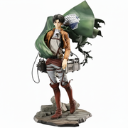 Statue of a character from an anime or manga with a green cape and weapon on a white background