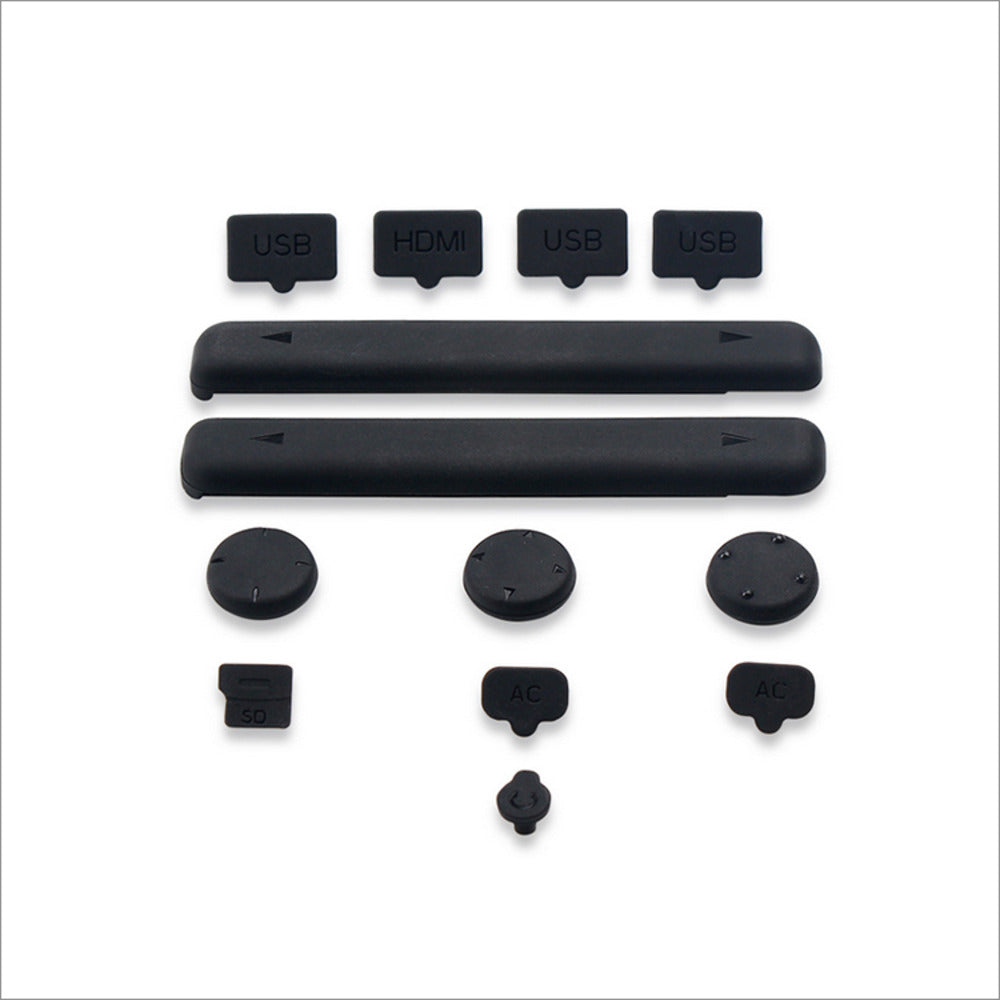 A collection of black rubber covers for Nintendo Switch ports and a glass screen protector.