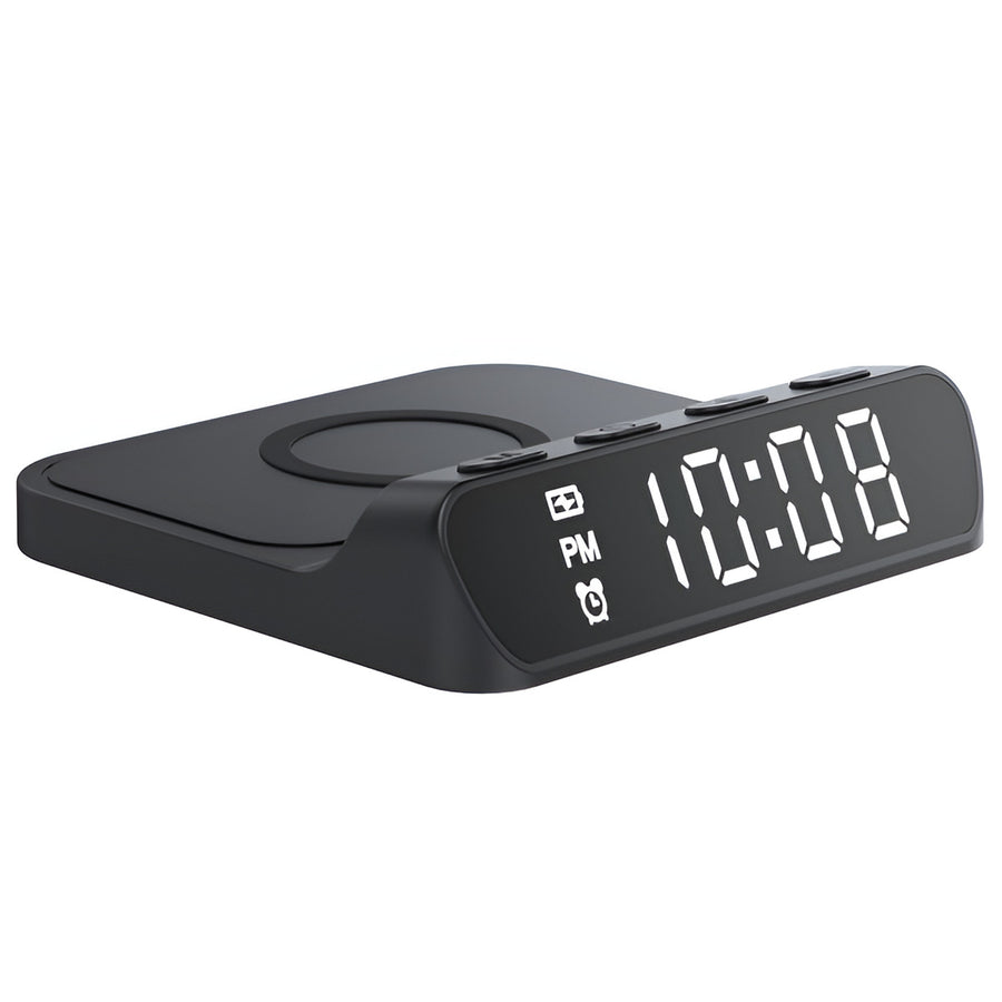 Black digital clock with wireless charging pad on a white background