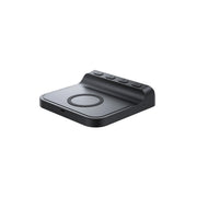 Black wireless charging pad on a white background