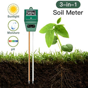 3-in-1 soil meter with sunlight, moisture, and pH indicators next to a plant and soil???