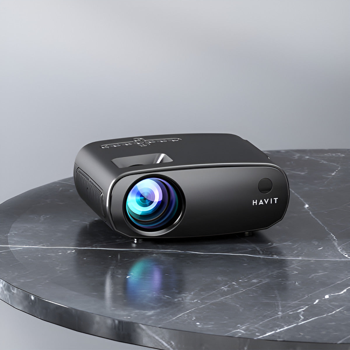 Black HAVIT projector on a gray marble surface with a gray background