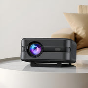 Black projector on a white surface with a blurred background