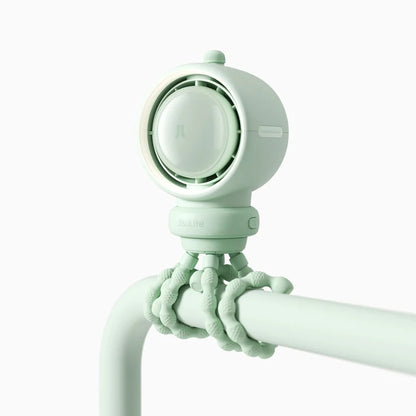 Mint green shower head with flexible arm on a white background