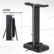 Black headphone stand with cable hook on a white background