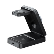 Black phone stand with wireless charging pad on a white background