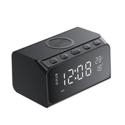 Black digital clock with wireless charging pad on a white background