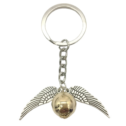 Keychain with gold ball and silver wings on a white background / Harry Potter Golden Snitch Keyring