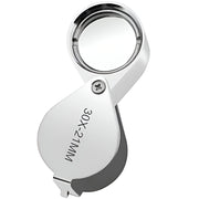 Silver magnifying glass with 30x magnification on a white background / Magnifying Jewelers Eye Loupe - 30x Magnification