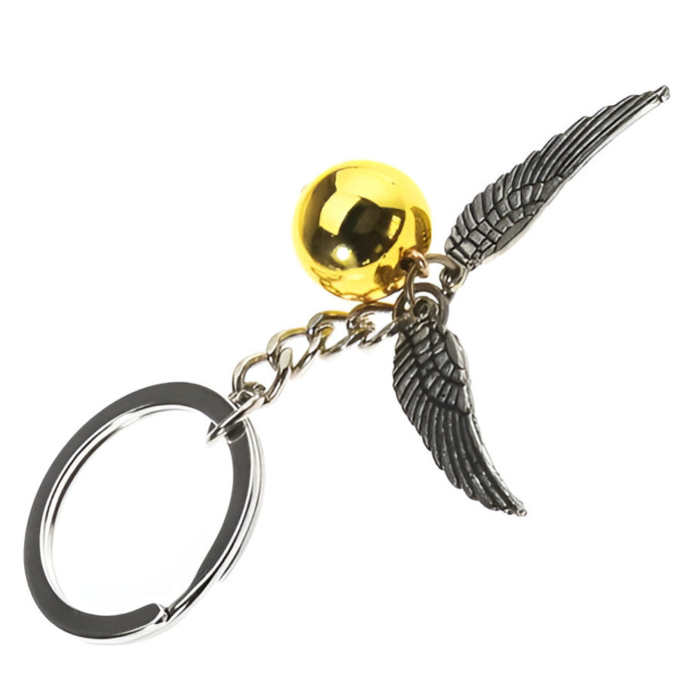 Keychain with gold sphere and silver winged key on a white background / Harry Potter Golden Snitch Keyring