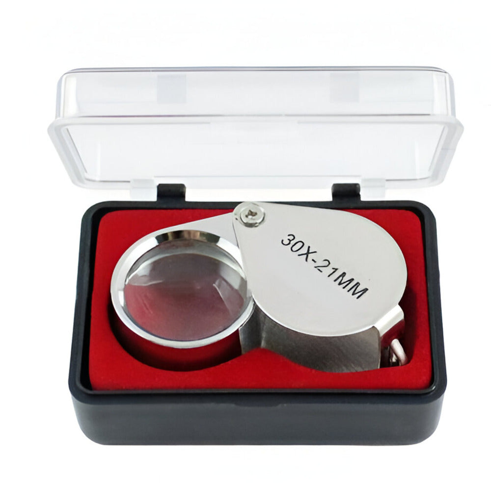 Silver magnifying glass with red interior in a clear box on a white background / Magnifying Jewelers Eye Loupe - 30x Magnification