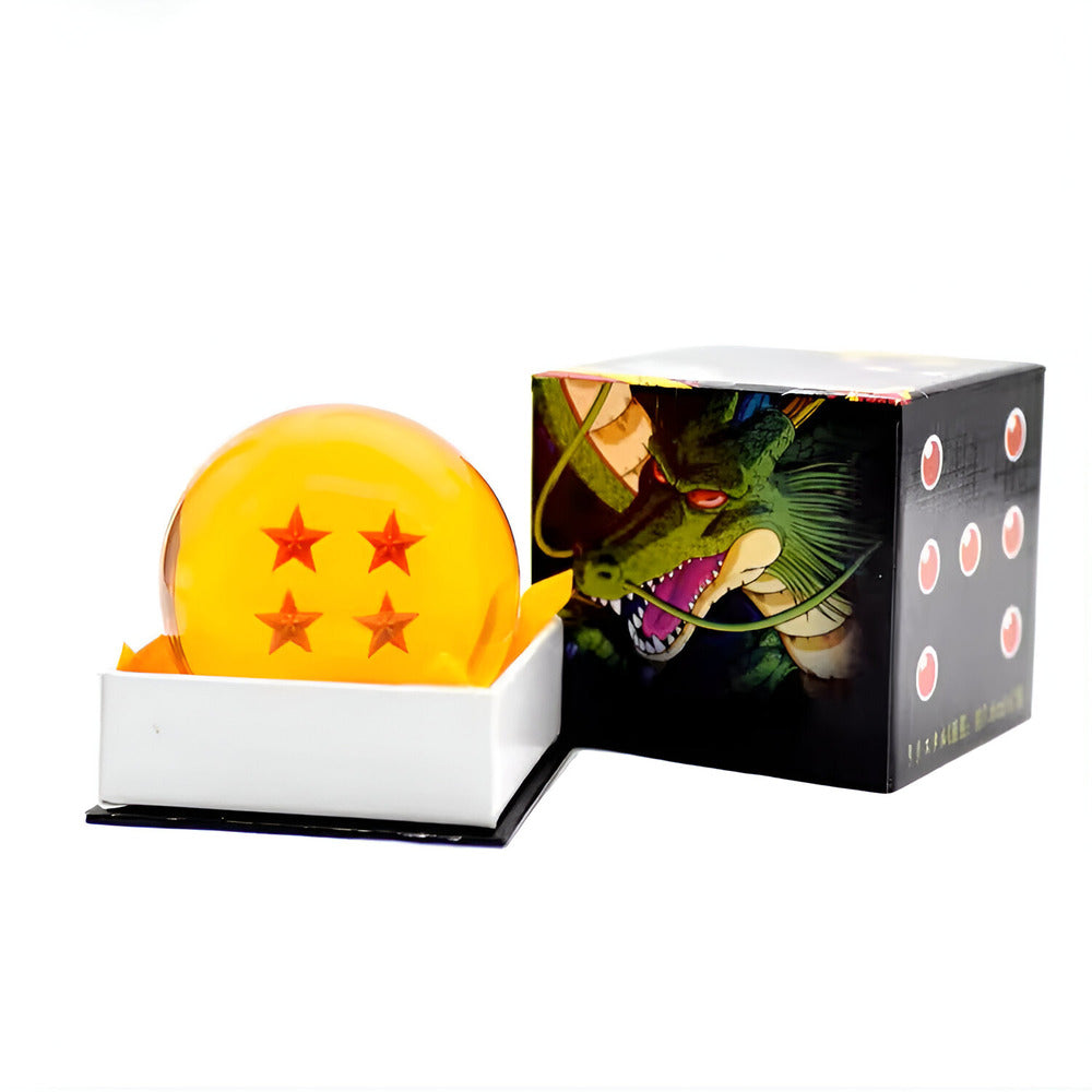 Yellow ball with star symbols in front of a colorful box featuring a dragon design. / Dragon Ball Z Crystal Ball - Mini