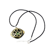 Gold and black pendant necklace on a white background Marvels Doctor Strange - Eye of Agamotto Necklace