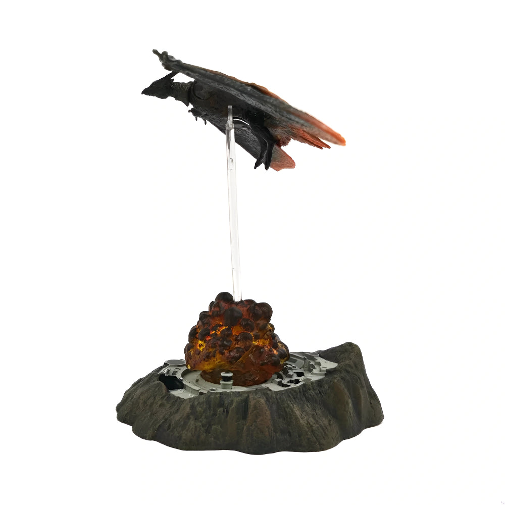 Decorative item with a bird perched on a rocky outcrop on a white background